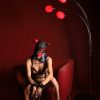 Banoch madrettor woman wearing a red puppy play hood